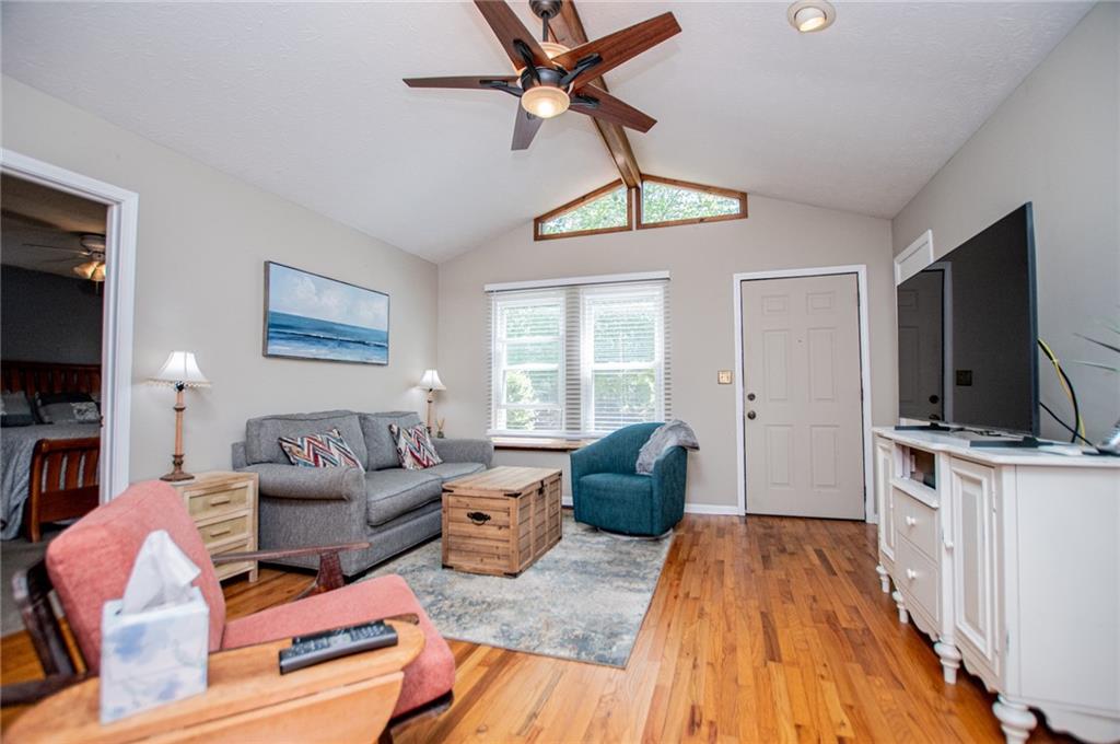 1385 Lakeview Parkway Villa Rica, GA 30180 - Photo 24 of 71 a living room with furniture a flat screen tv and a window