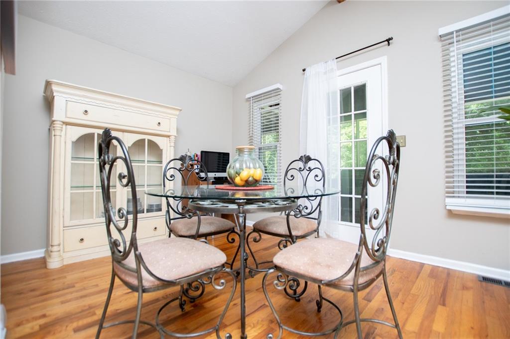 1385 Lakeview Parkway Villa Rica, GA 30180 - Photo 25 of 71 a view of a dining room with furniture window and wooden floor