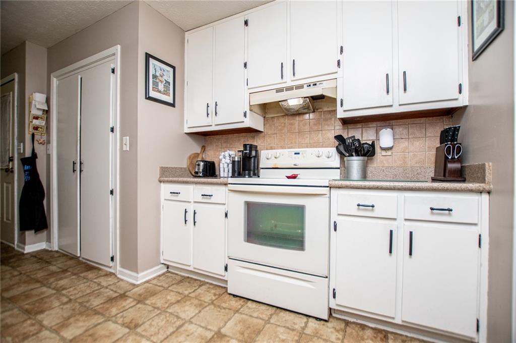 1385 Lakeview Parkway Villa Rica, GA 30180 - Photo 34 of 71 a kitchen with cabinets and appliances
