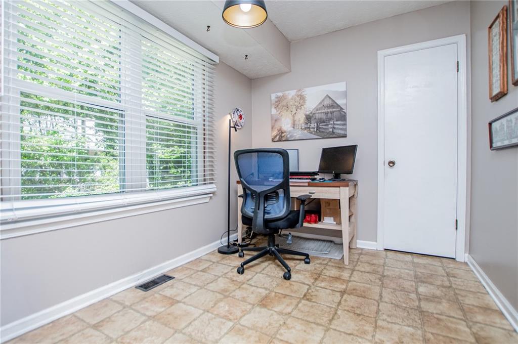 1385 Lakeview Parkway Villa Rica, GA 30180 - Photo 36 of 71 a view of a workspace with furniture and a window