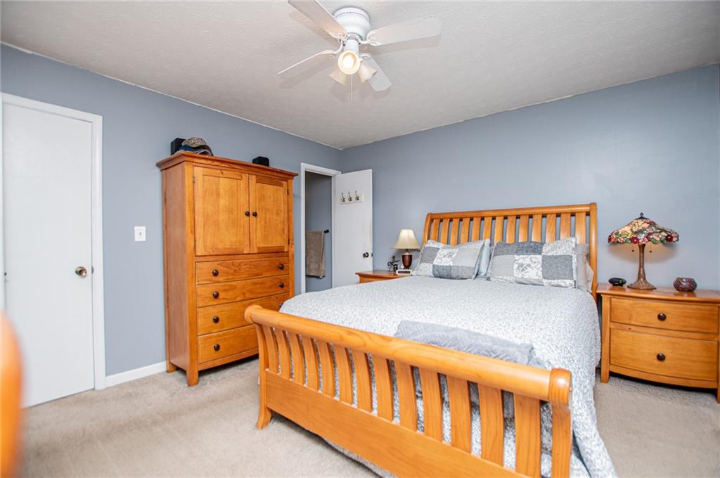 1385 Lakeview Parkway Villa Rica, GA 30180 - Photo 38 of 71 a bedroom with a bed and a dresser