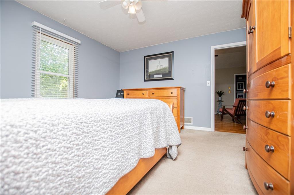 1385 Lakeview Parkway Villa Rica, GA 30180 - Photo 40 of 71 a bedroom with a bed and a window