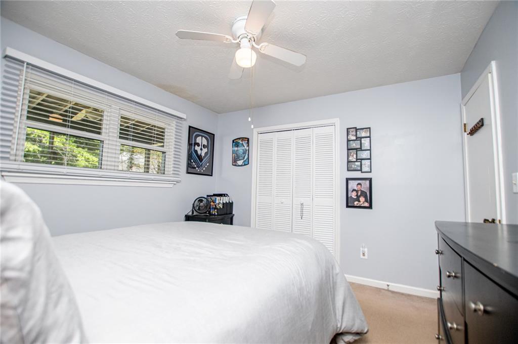 1385 Lakeview Parkway Villa Rica, GA 30180 - Photo 47 of 71 a bedroom with a bed and a window