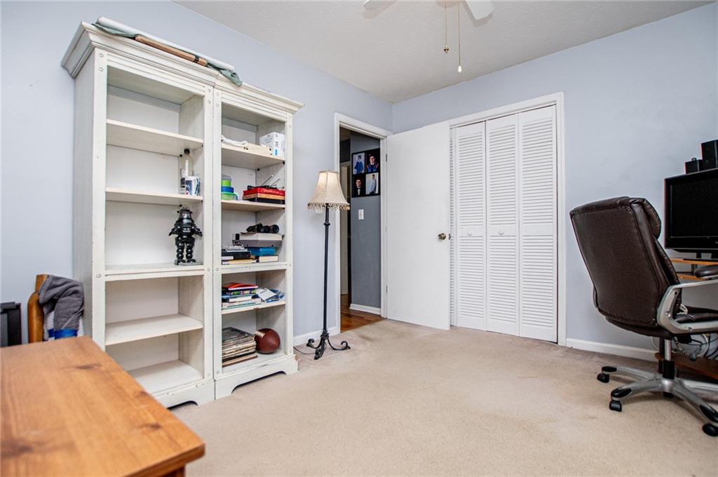 1385 Lakeview Parkway Villa Rica, GA 30180 - Photo 49 of 71 a view of a workspace with furniture and bedroom view