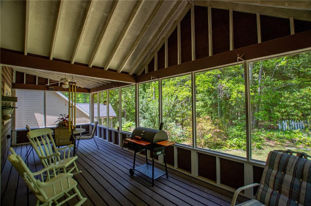 1385 Lakeview Parkway Villa Rica, GA 30180 - Photo 53 of 71 a view of a chairs and table in patio with wooden fence