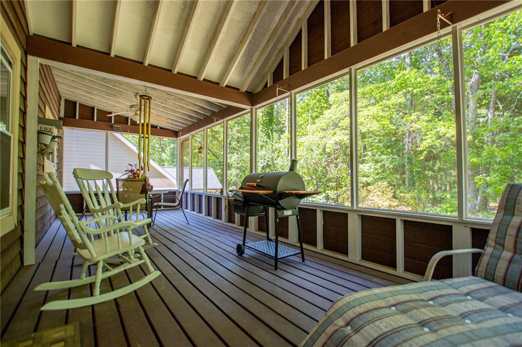 1385 Lakeview Parkway Villa Rica, GA 30180 - Photo 54 of 71 a view of a balcony with chairs and wooden floor