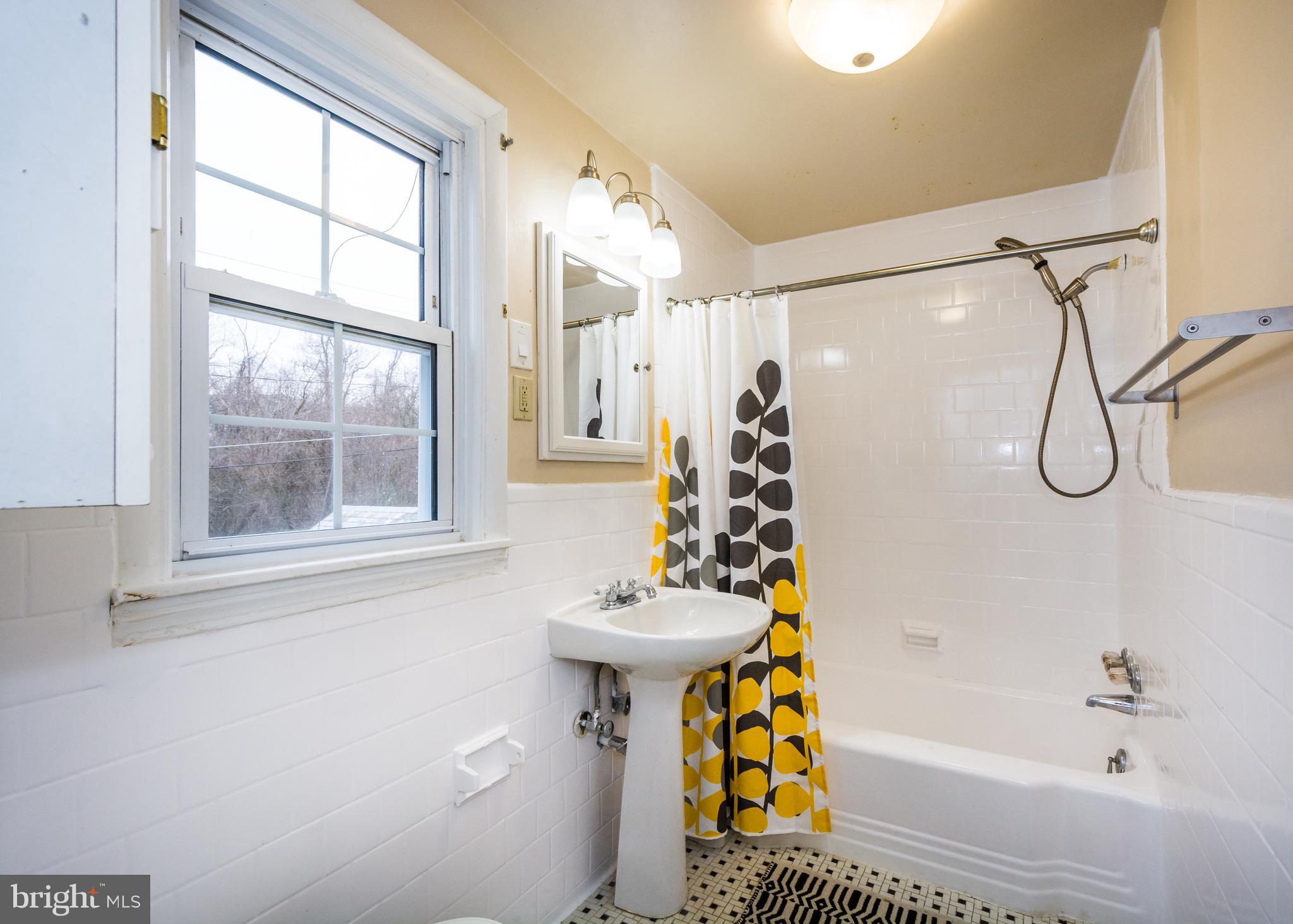 736 Warwick Road Baltimore, MD 21229 - Photo 40 of 54 Floor to ceiling tiled shower