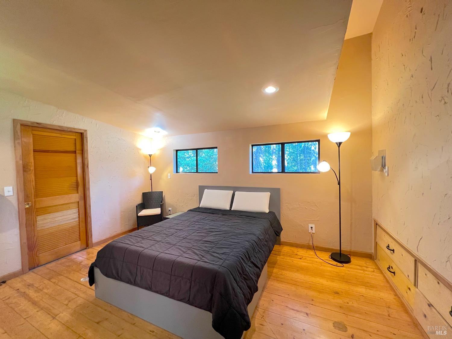 4000 Ridgewood Road Willits, CA 95490 - Photo 26 of 42 a spacious bedroom with a bed and a window
