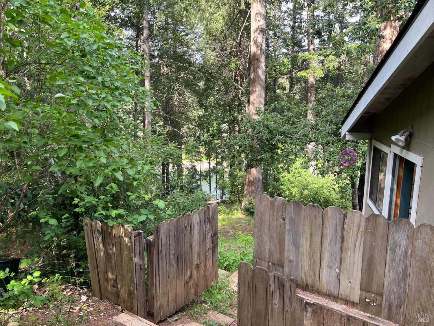 4000 Ridgewood Road Willits, CA 95490 - Photo 33 of 42 a view of a backyard with wooden fence
