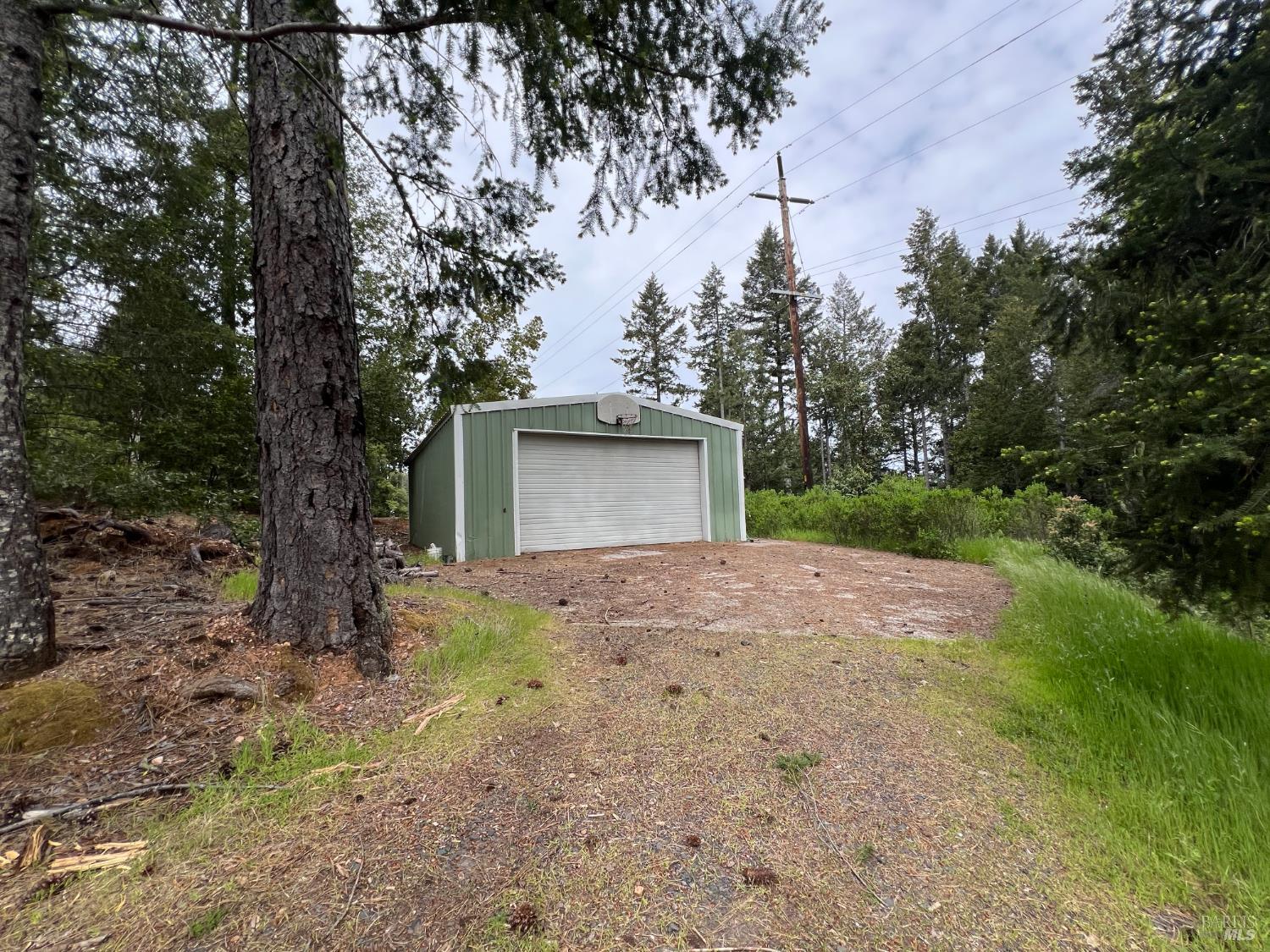 4000 Ridgewood Road Willits, CA 95490 - Photo 39 of 42 a view of a house with a yard and garage