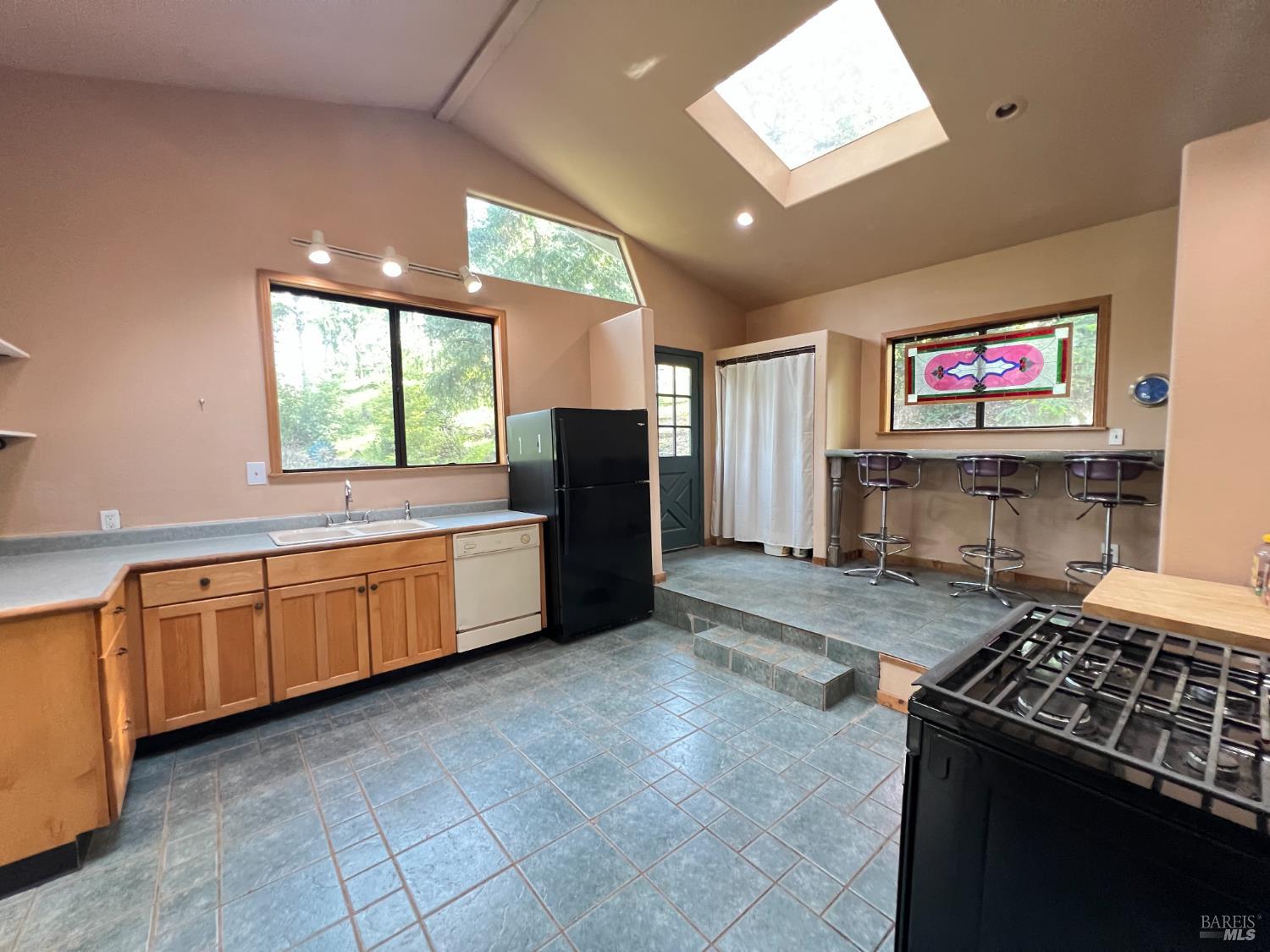 4000 Ridgewood Road Willits, CA 95490 - Photo 8 of 42 a large kitchen with stainless steel appliances granite countertop a stove and a sink