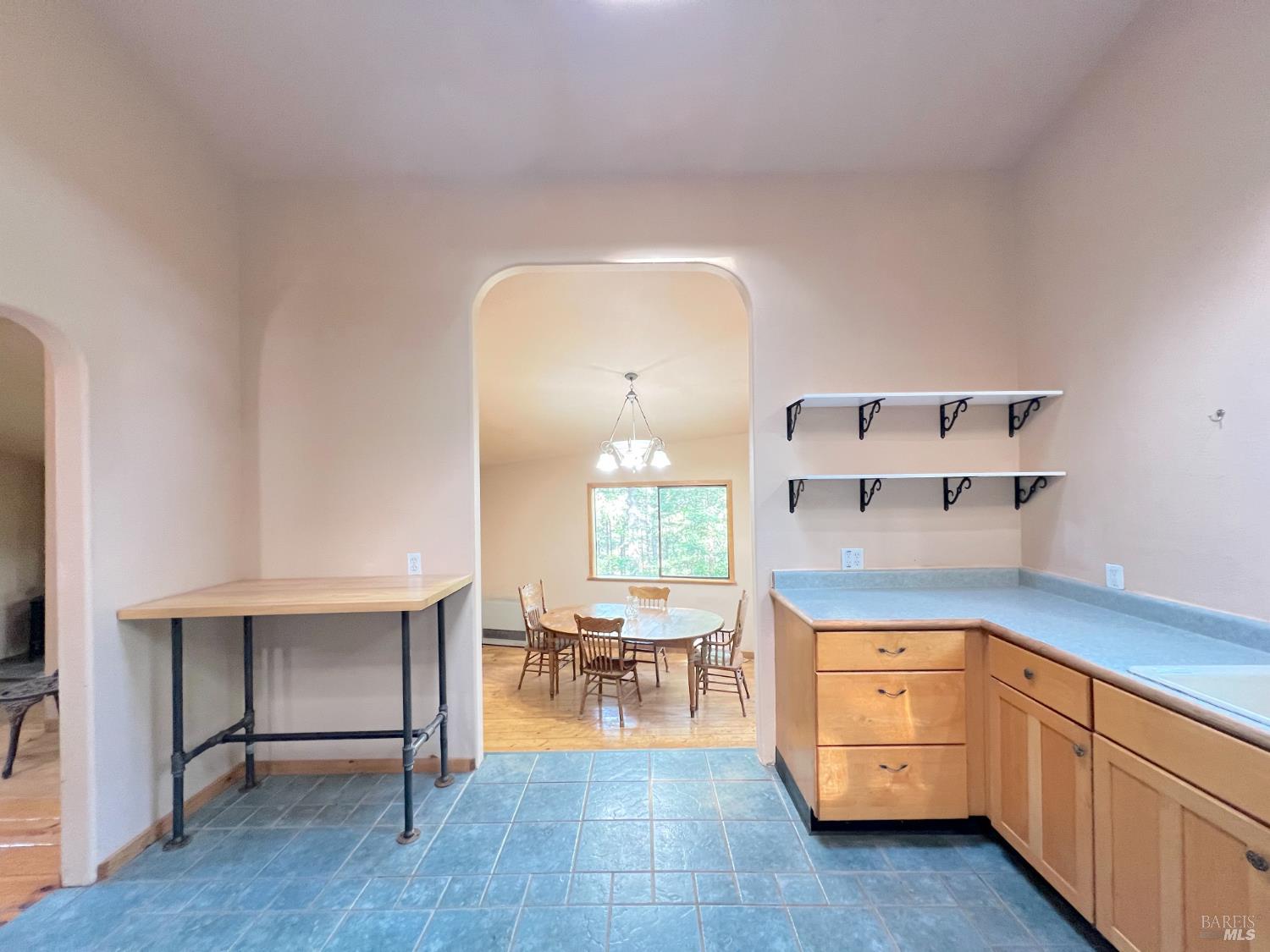 4000 Ridgewood Road Willits, CA 95490 - Photo 10 of 42 a kitchen with a sink cabinets and dining table chair