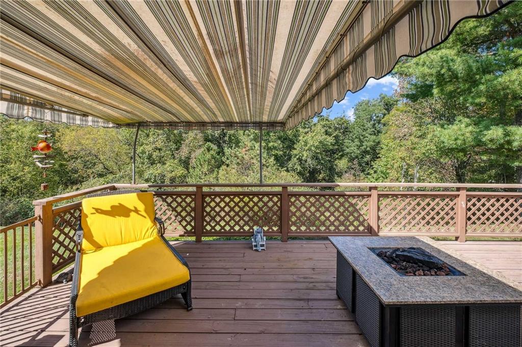 2584 Grouse Ridge, Unit A Wexford, PA 15090 - Photo 21 of 27 a view of a balcony with wooden floor and outdoor seating