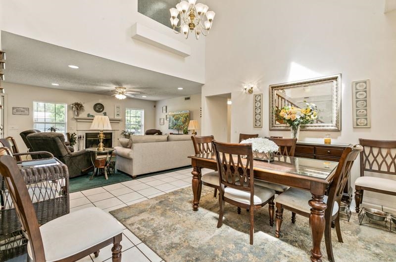 173 Stokes Landing Road St. Augustine, FL 32095 - Photo 14 of 71 a living room with furniture kitchen and a chandelier