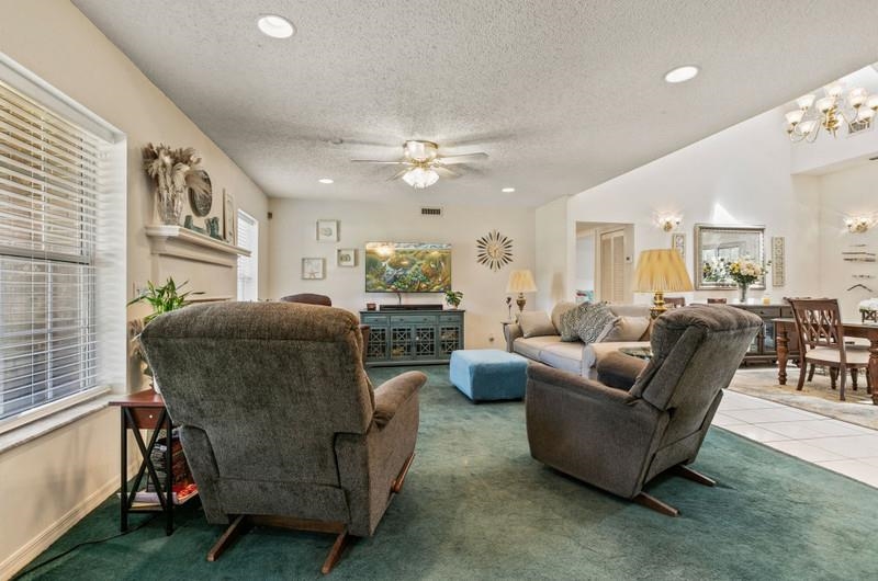 173 Stokes Landing Road St. Augustine, FL 32095 - Photo 16 of 71 a living room with furniture and a large window