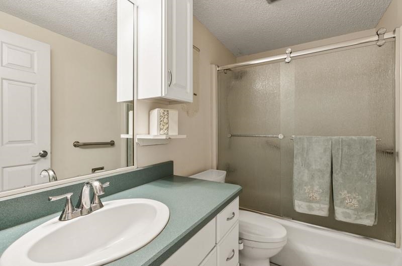 173 Stokes Landing Road St. Augustine, FL 32095 - Photo 20 of 71 a bathroom with a sink toilet and shower