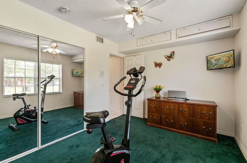 173 Stokes Landing Road St. Augustine, FL 32095 - Photo 22 of 71 a room with lots of white furniture and a chandelier