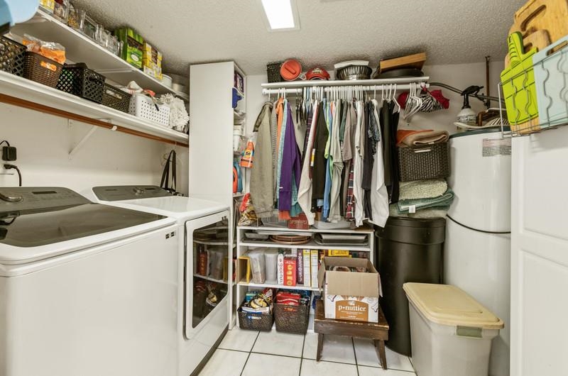 173 Stokes Landing Road St. Augustine, FL 32095 - Photo 31 of 71 a view of walk in closet with clothes and shoes