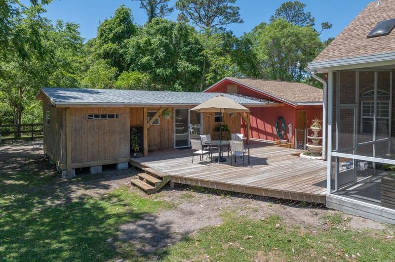 173 Stokes Landing Road St. Augustine, FL 32095 - Photo 46 of 71 a view of a house with backyard and sitting area