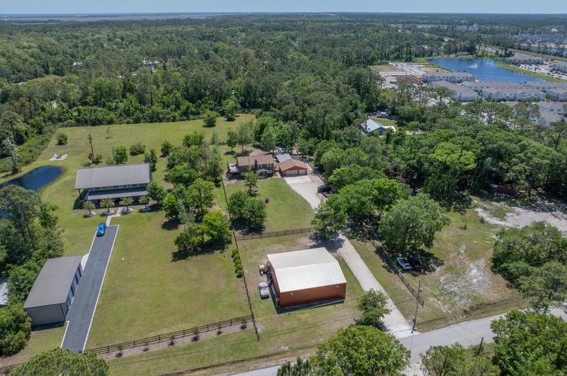 173 Stokes Landing Road St. Augustine, FL 32095 - Photo 62 of 71 an aerial view of a house with a yard