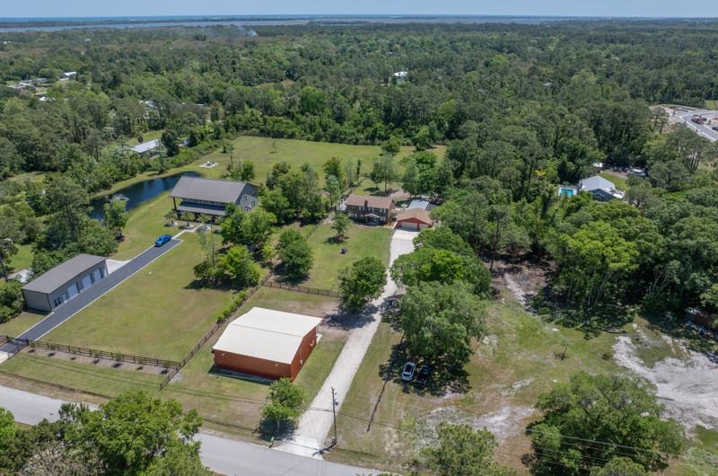 173 Stokes Landing Road St. Augustine, FL 32095 - Photo 63 of 71 an aerial view of a house with a yard