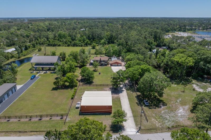 173 Stokes Landing Road St. Augustine, FL 32095 - Photo 64 of 71 an aerial view of a house with yard