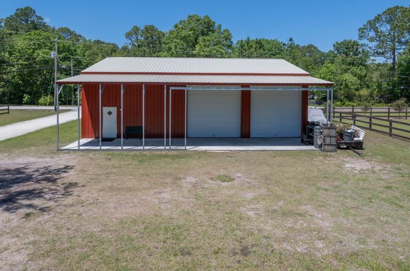 173 Stokes Landing Road St. Augustine, FL 32095 - Photo 8 of 71 a front view of a house with a yard