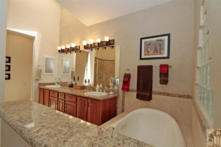 79175 Bermuda Dunes Drive Bermuda Dunes, CA 92203 - Photo 11 of 21 a bathroom with a tub sink and mirror