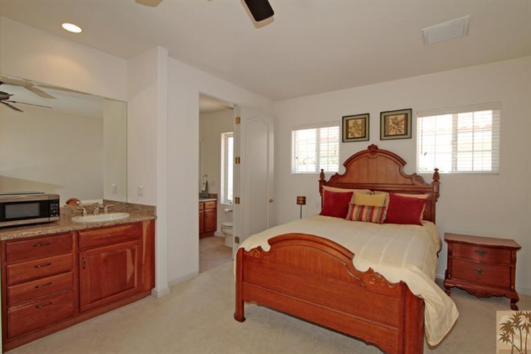 79175 Bermuda Dunes Drive Bermuda Dunes, CA 92203 - Photo 12 of 21 a bedroom with a bed and wooden floor