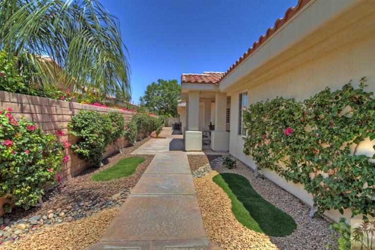 79175 Bermuda Dunes Drive Bermuda Dunes, CA 92203 - Photo 17 of 21 a view of a house with a flower garden