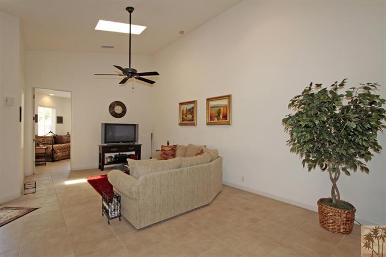 79175 Bermuda Dunes Drive Bermuda Dunes, CA 92203 - Photo 6 of 21 a living room with furniture and a potted plant
