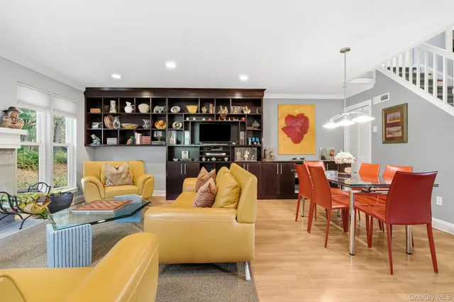 a living room with furniture and lamp