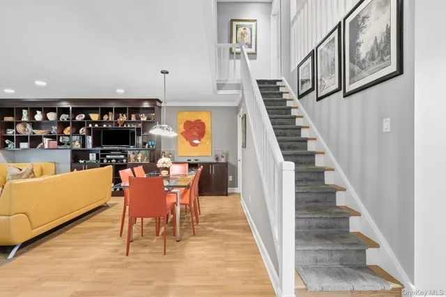 a dining room with furniture and entryway