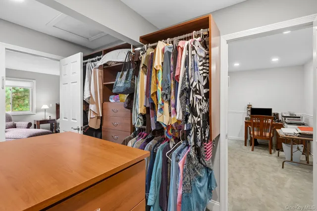 a bed room with a bed and a chair