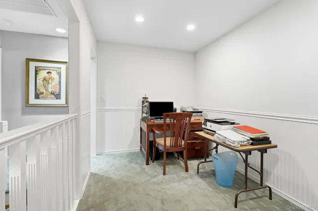 a view of a workspace with furniture