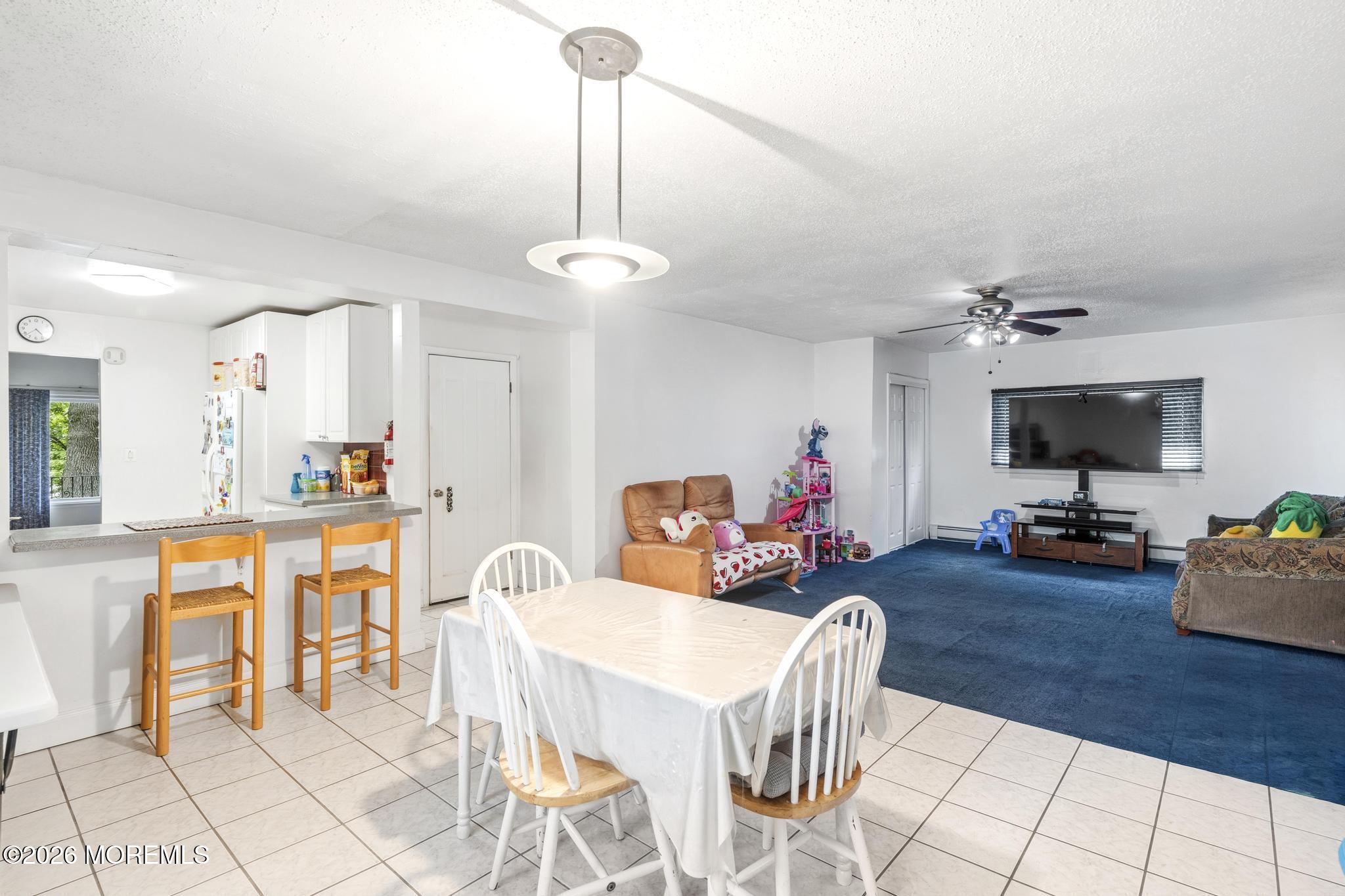 1914 Rutherford Avenue Neptune Township, NJ 07753 - Photo 13 of 25 a view of a dining room with furniture