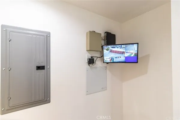 a kitchen with appliances a sink a table and chairs in it