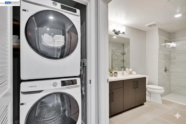 a view of a hallway with washer and dryer
