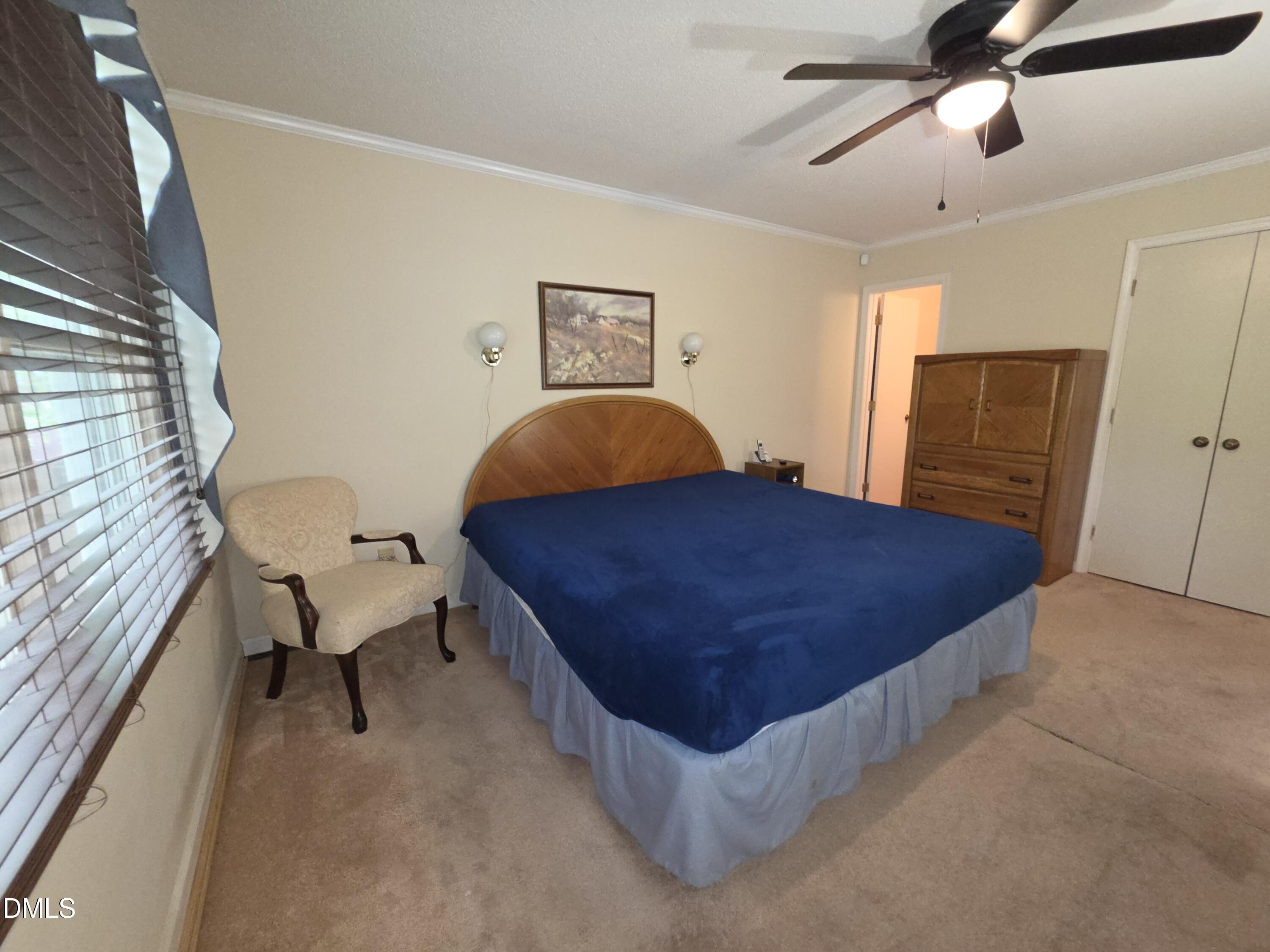 84 Candytuff Lane Durham, NC 27713 - Photo 11 of 23 a bedroom with a bed and wooden floor