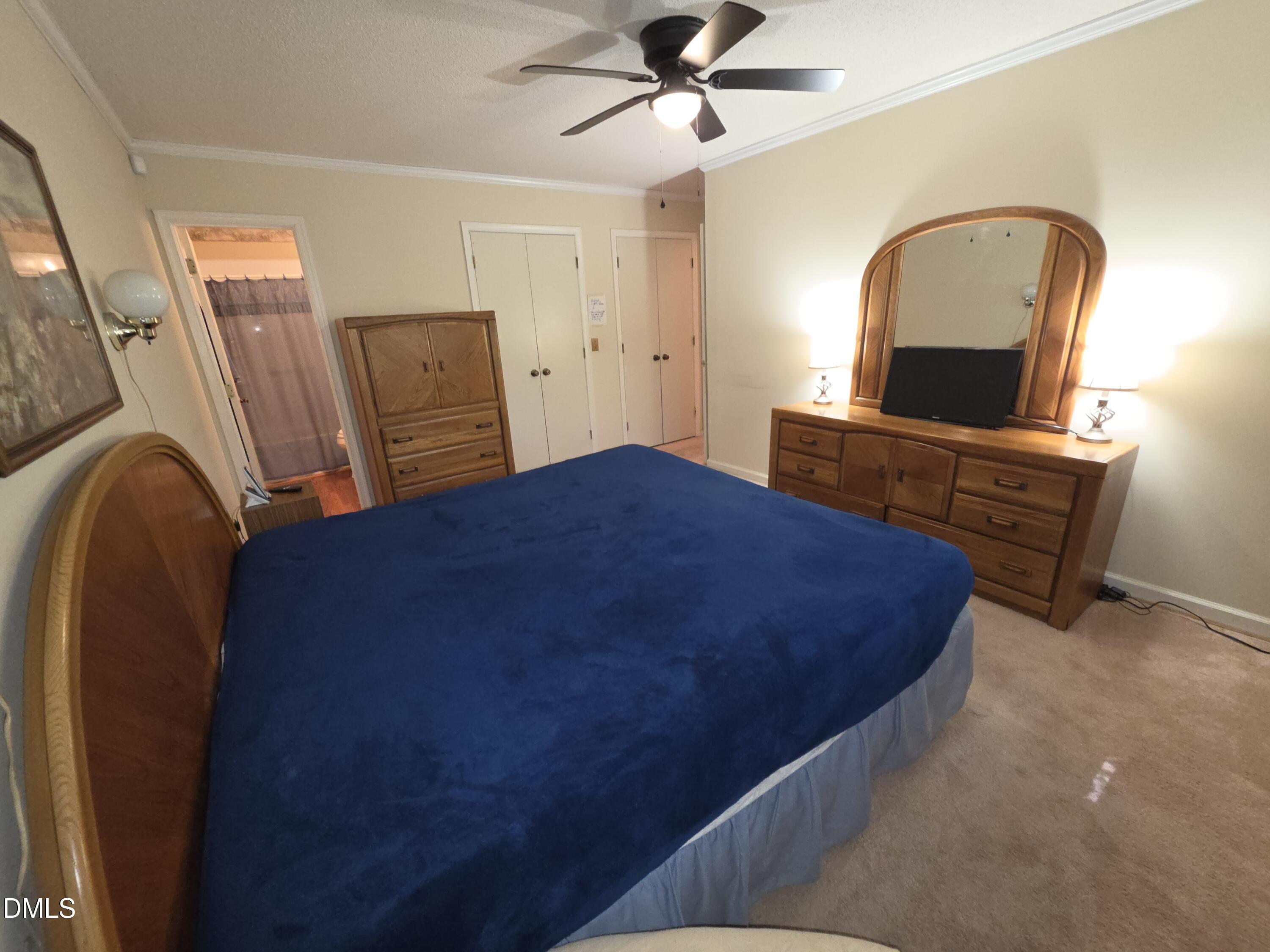 84 Candytuff Lane Durham, NC 27713 - Photo 12 of 23 a bedroom with a bed and a dresser