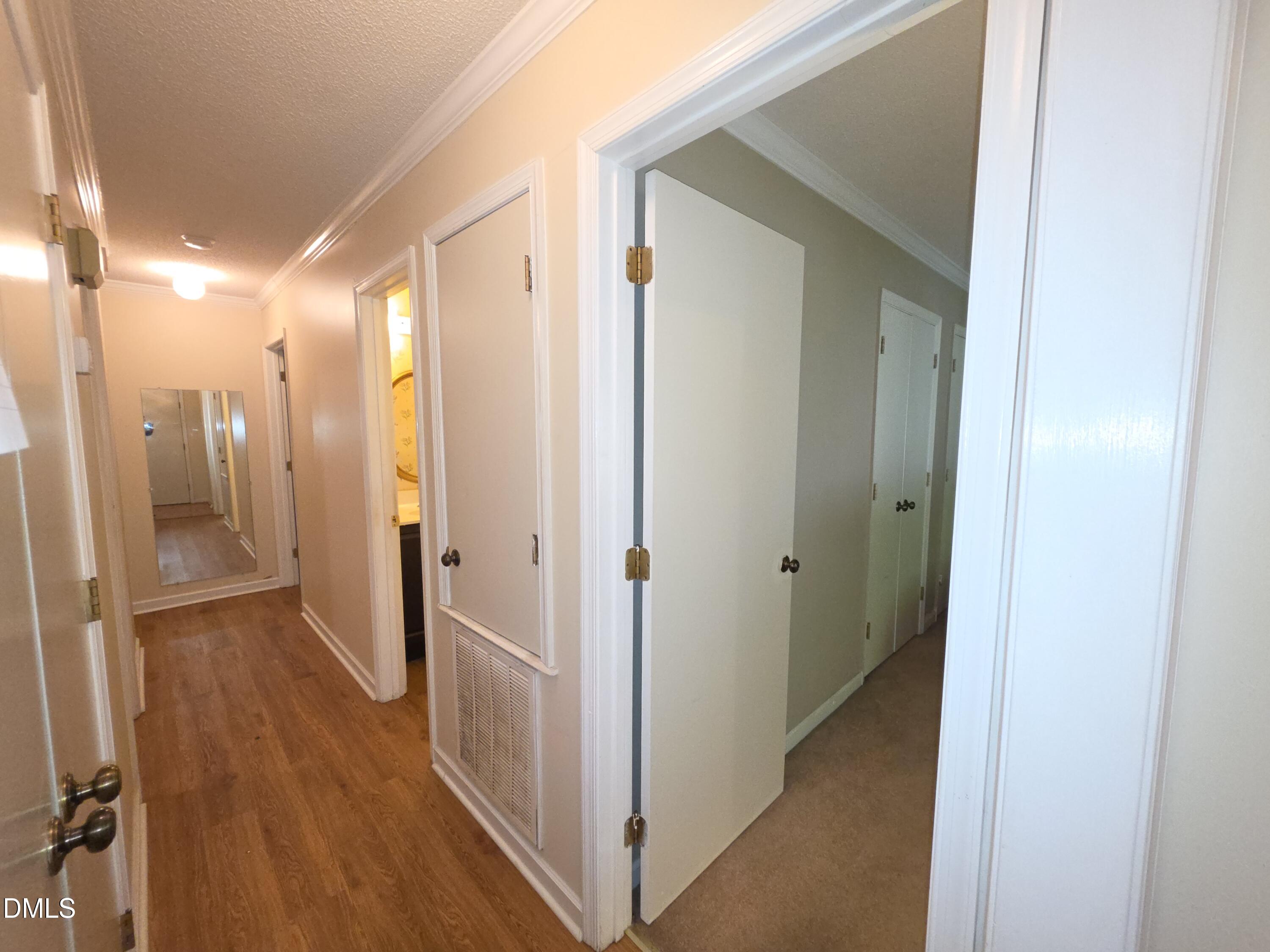 84 Candytuff Lane Durham, NC 27713 - Photo 14 of 23 a view of a hallway with wooden floor