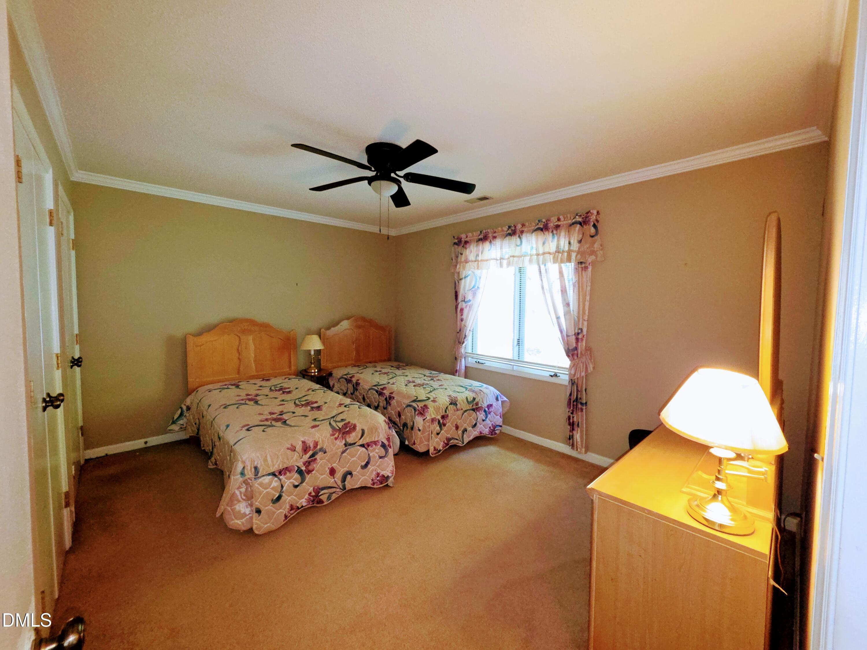 84 Candytuff Lane Durham, NC 27713 - Photo 16 of 23 a bedroom with a bed and a window