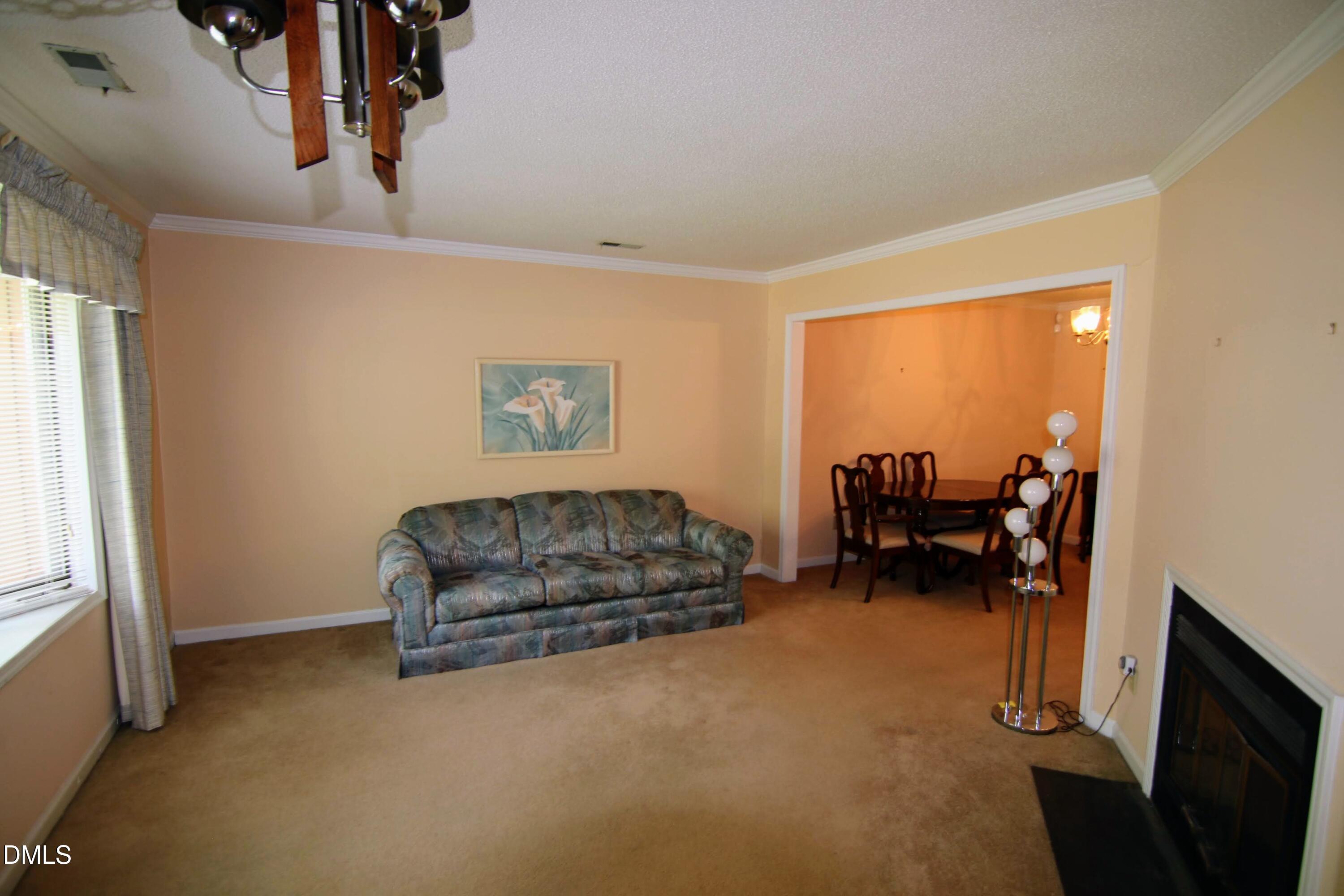 84 Candytuff Lane Durham, NC 27713 - Photo 3 of 23 a living room with furniture and a flat screen tv