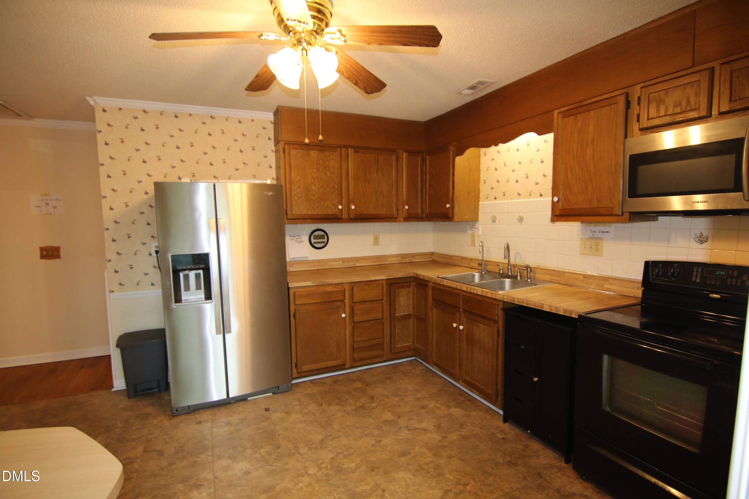 84 Candytuff Lane Durham, NC 27713 - Photo 9 of 23 a kitchen with a sink appliances and cabinets