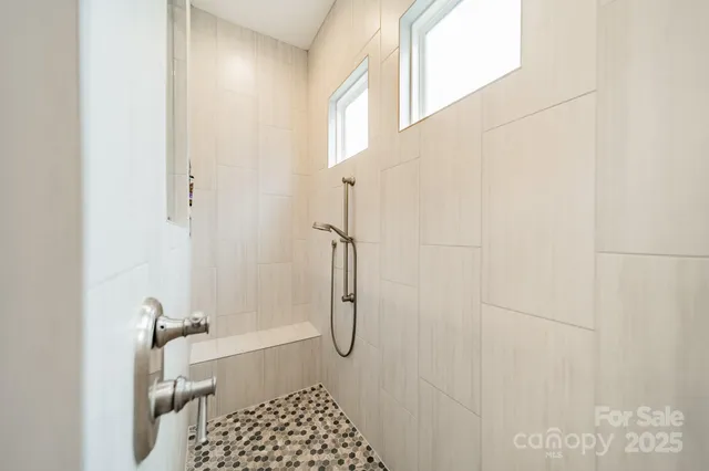 a bathroom with a double vanity sink mirror and double