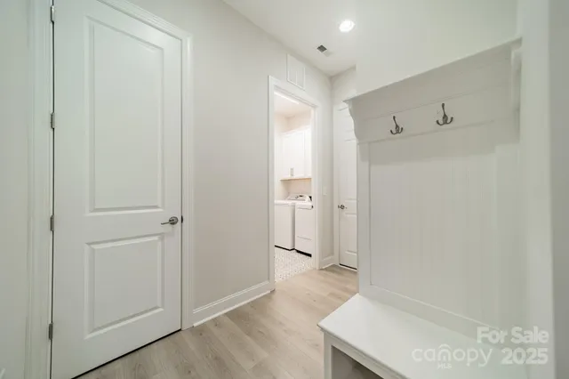 a view of entryway with wooden floor