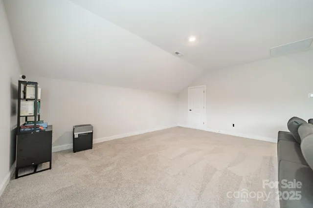 a balcony with furniture and a potted plant