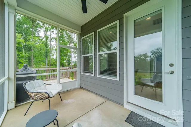 a view of balcony with wooden floor and fence