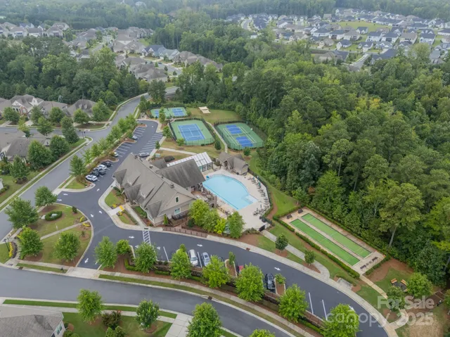an aerial view of ocean and trees