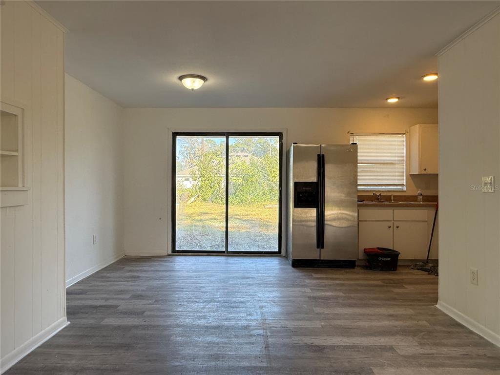 2213 Northwest 24th Road Ocala, FL 34475 - Photo 5 of 6 a view of a kitchen with a sink and a refrigerator